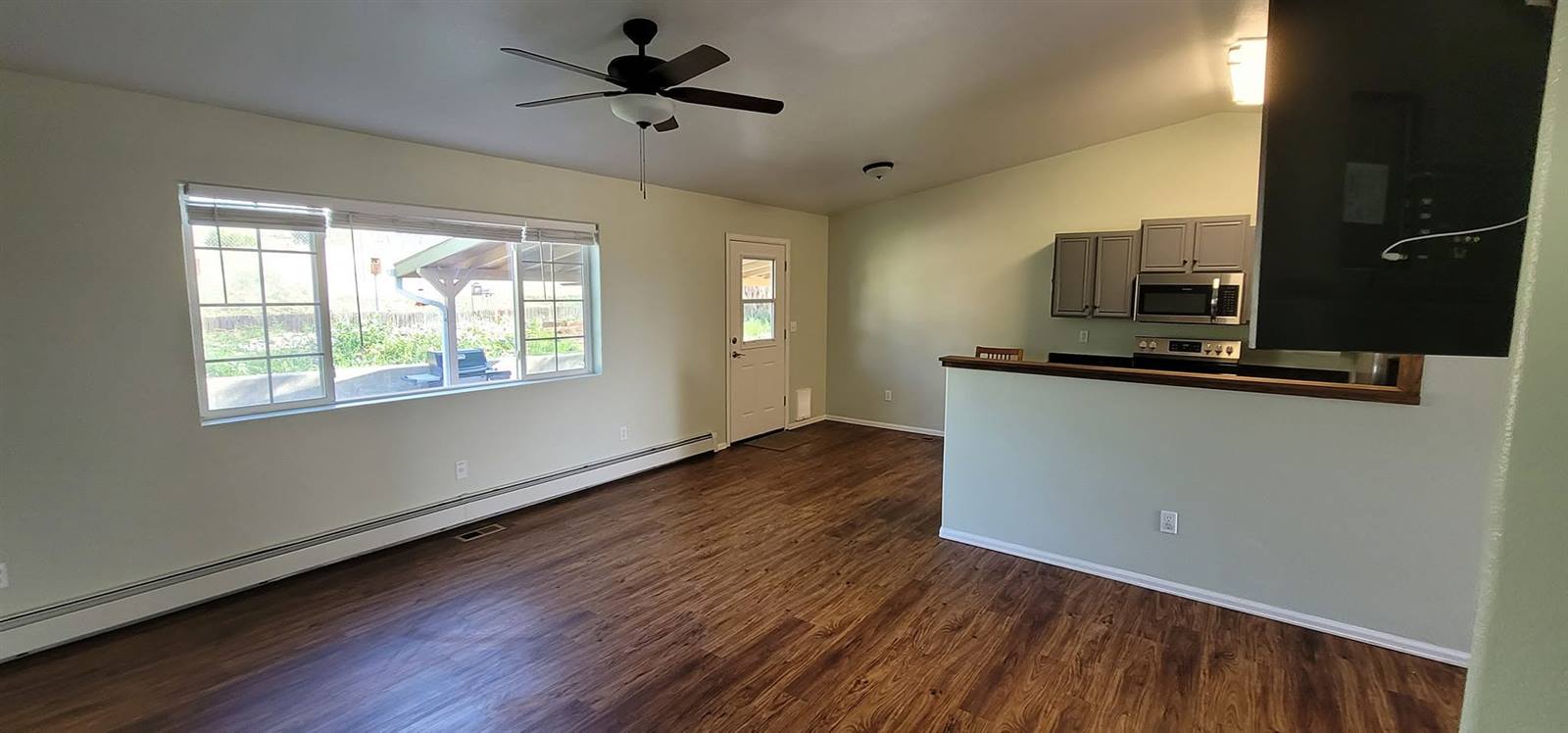 Freshly painted open-concept kitchen and living room